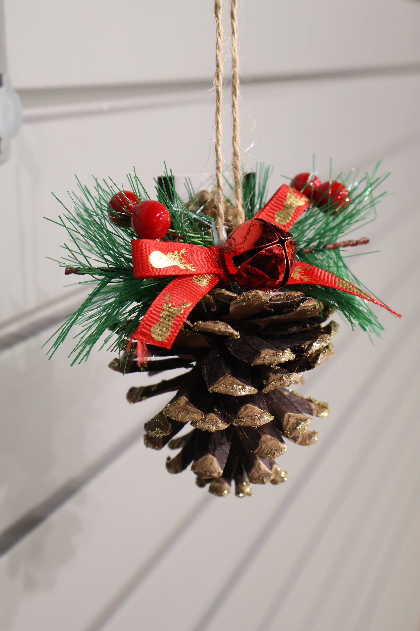 AG-37 | Artificial Pinecone Christmas Hanging Ornament with Red Ribbon & Bell – 3.5" × 3" (9 × 8 cm)